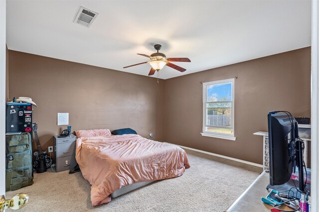 bedroom featuring ceiling fan and light colored carpet