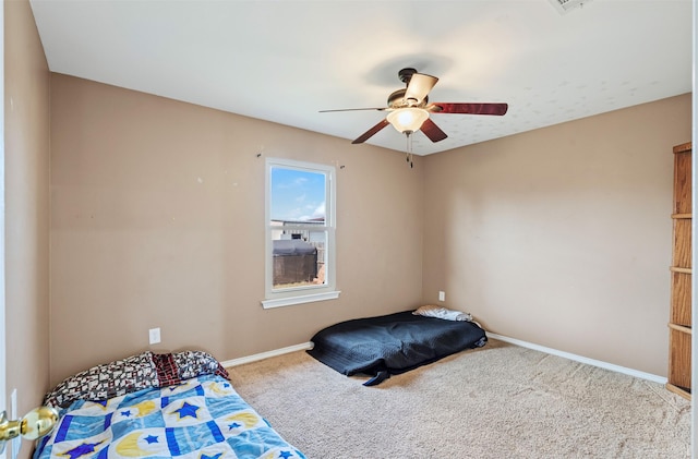 unfurnished bedroom with ceiling fan and carpet flooring