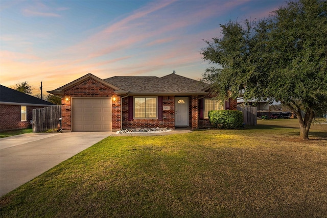 single story home with a yard and a garage