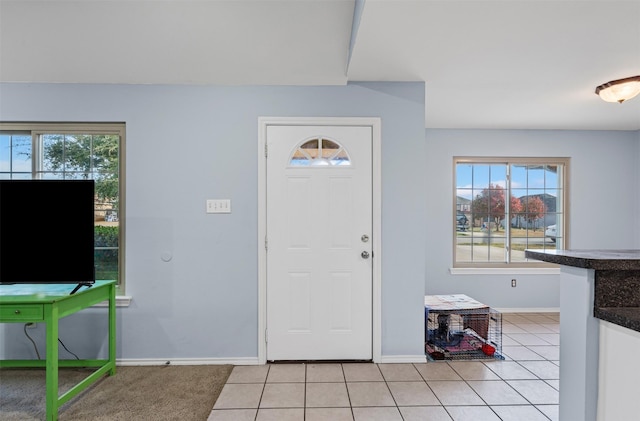 entrance foyer featuring light tile patterned floors