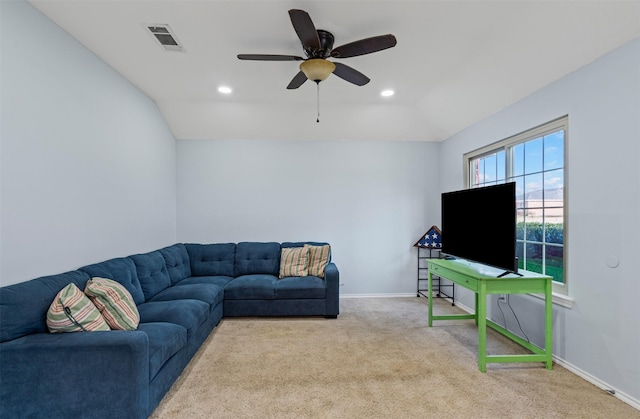 living room featuring ceiling fan, lofted ceiling, and light carpet