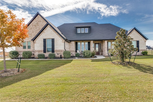 craftsman-style house with a front lawn