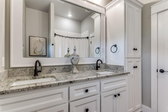 bathroom with vanity and walk in shower