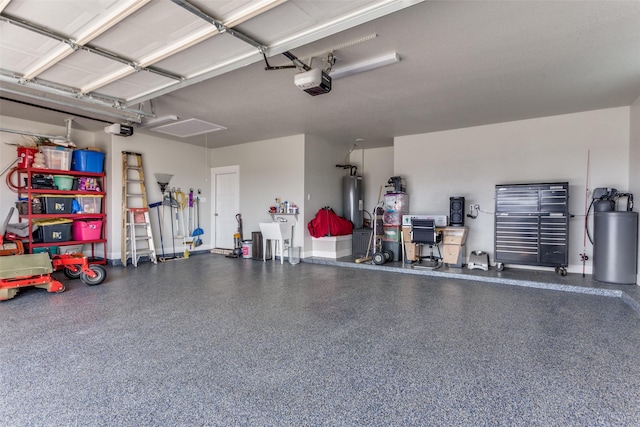 garage with sink, a garage door opener, and water heater