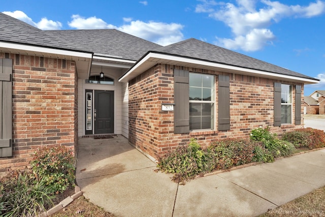 entrance to property with a patio area