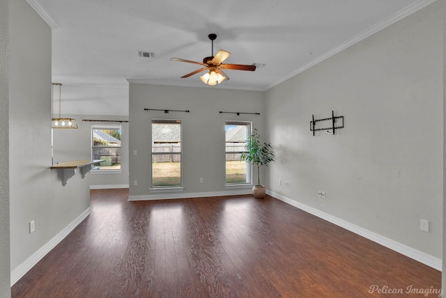 empty room with ornamental molding and dark wood-type flooring