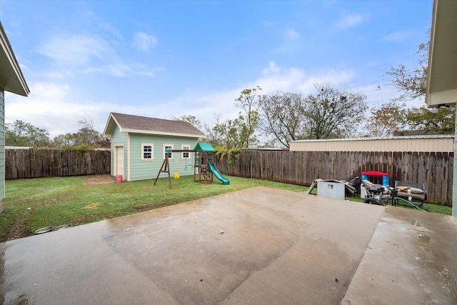 view of patio / terrace with an outbuilding and a playground