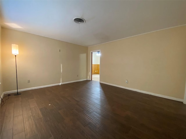 unfurnished room featuring dark hardwood / wood-style flooring