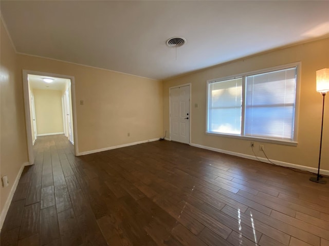 unfurnished room with dark hardwood / wood-style floors