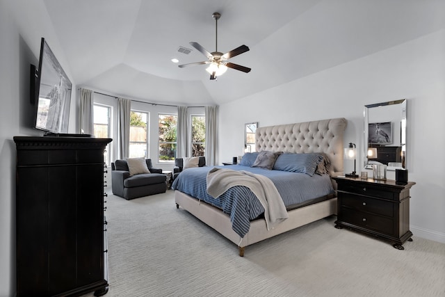 carpeted bedroom featuring lofted ceiling and ceiling fan