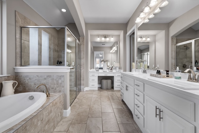 bathroom featuring vanity and shower with separate bathtub