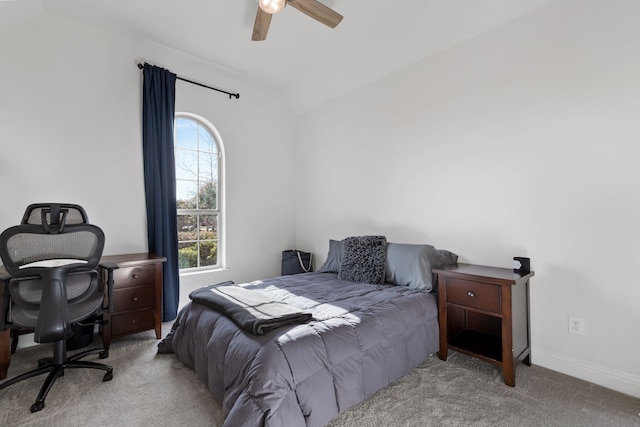 carpeted bedroom featuring lofted ceiling and ceiling fan