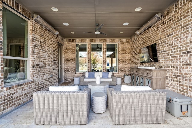 view of patio with ceiling fan and an outdoor living space