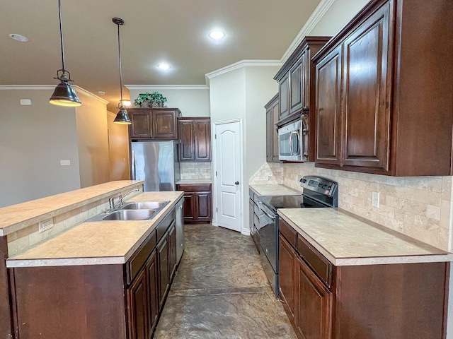 kitchen featuring sink, hanging light fixtures, backsplash, an island with sink, and appliances with stainless steel finishes