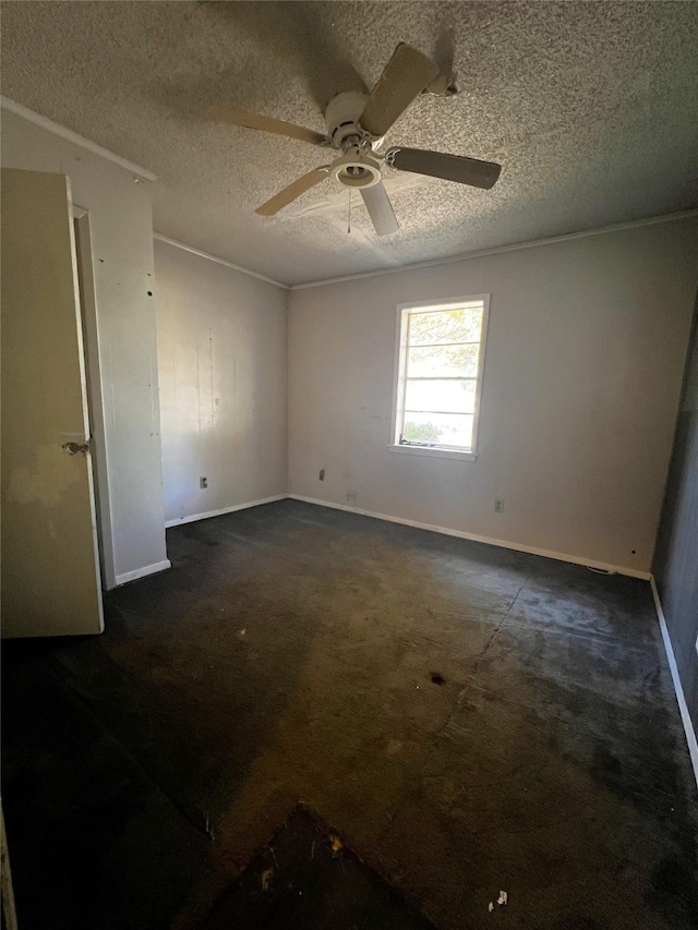 empty room featuring a textured ceiling and ceiling fan