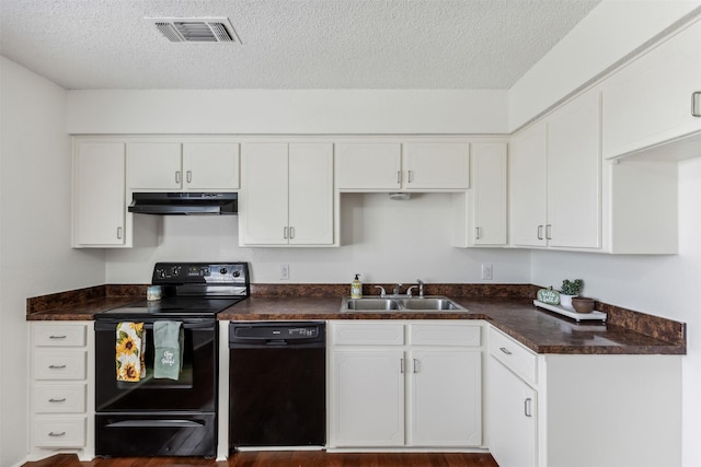 kitchen featuring black appliances, dark hardwood / wood-style floors, white cabinets, and sink