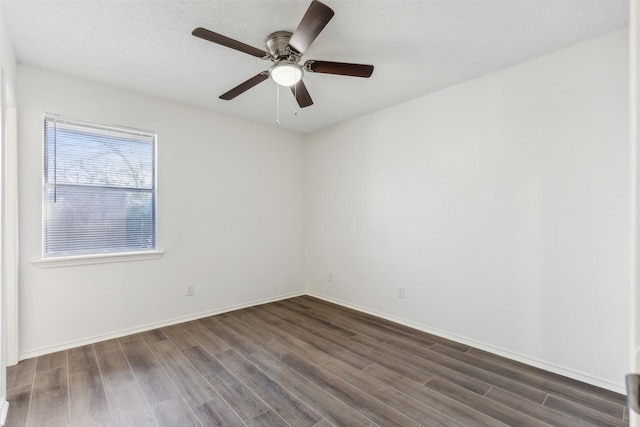 unfurnished room featuring ceiling fan, dark wood-type flooring, and a textured ceiling