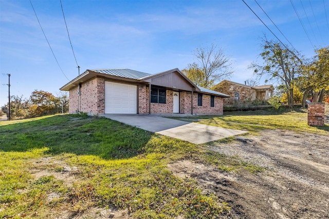 ranch-style home featuring a garage and a front lawn