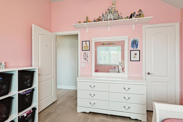 bedroom with light hardwood / wood-style floors