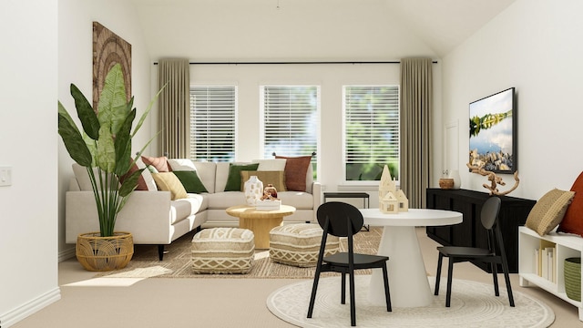 sitting room featuring carpet floors and vaulted ceiling