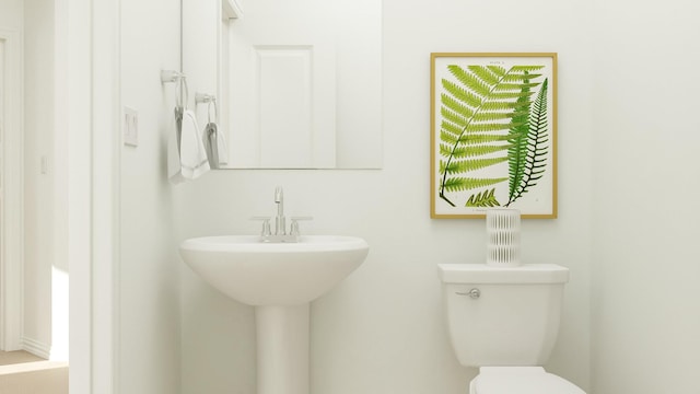 bathroom with toilet and sink