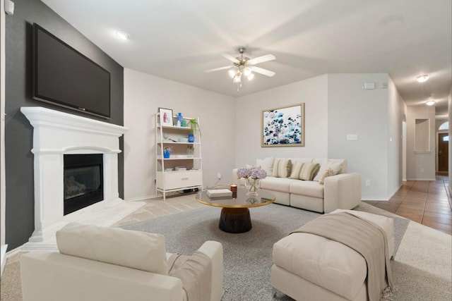 tiled living room with ceiling fan