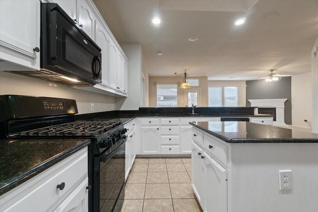 kitchen with black appliances, light tile patterned flooring, and white cabinetry