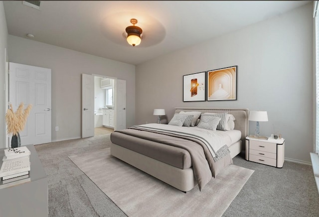 carpeted bedroom featuring ceiling fan and connected bathroom