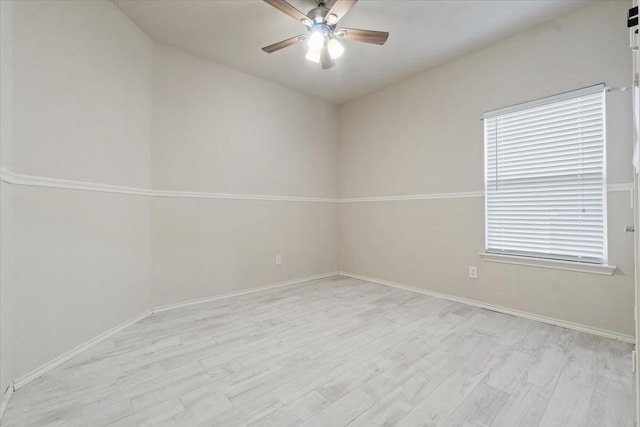 empty room featuring light hardwood / wood-style floors, ceiling fan, and a healthy amount of sunlight