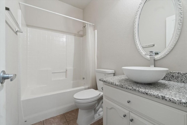 full bathroom featuring toilet, shower / tub combo, vanity, and tile patterned floors