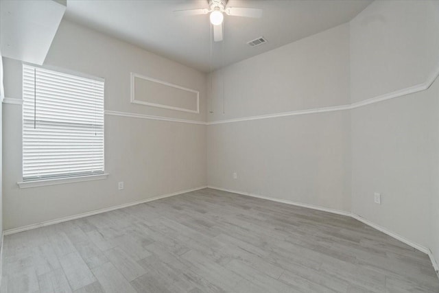 unfurnished room with ceiling fan and light hardwood / wood-style floors