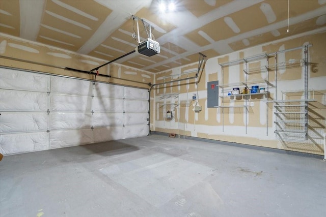 garage featuring electric panel and a garage door opener