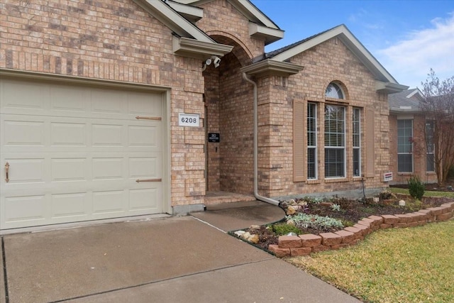 doorway to property featuring a garage