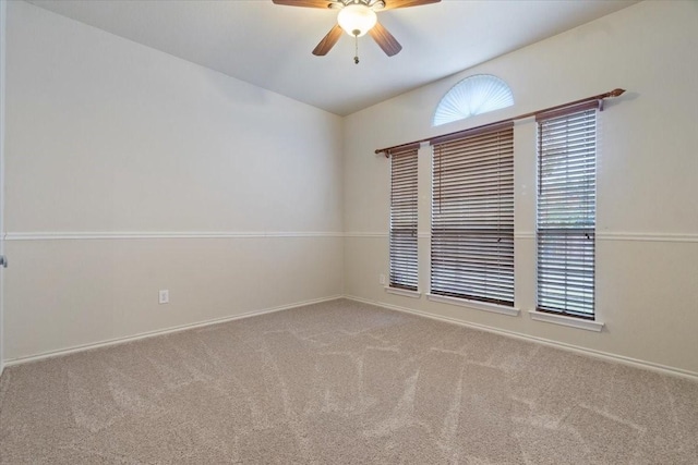 spare room with light carpet and ceiling fan