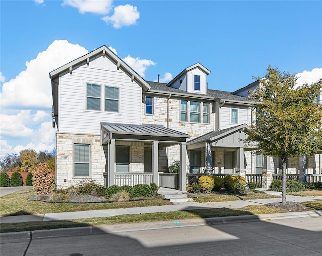 view of front of property featuring covered porch