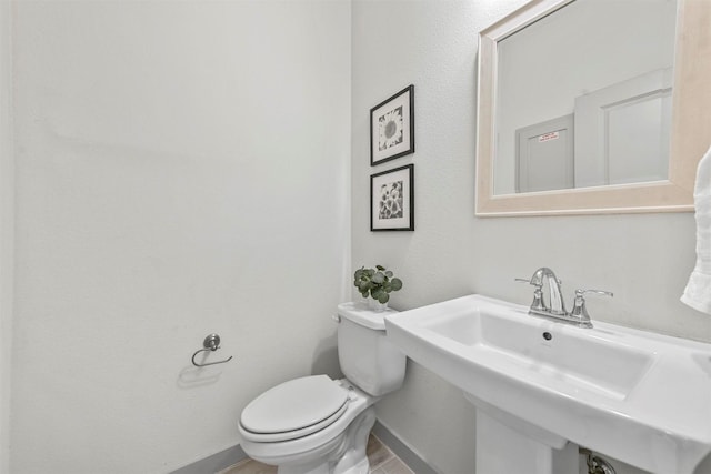 bathroom with toilet and sink