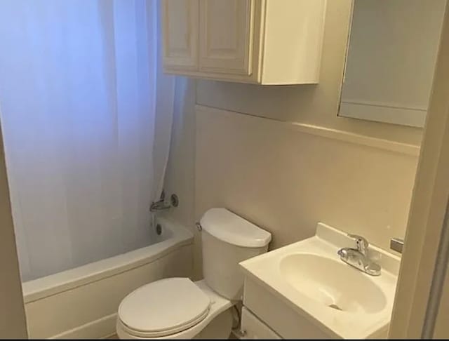 full bathroom featuring vanity,  shower combination, and toilet