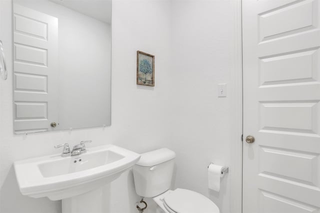 bathroom featuring sink and toilet