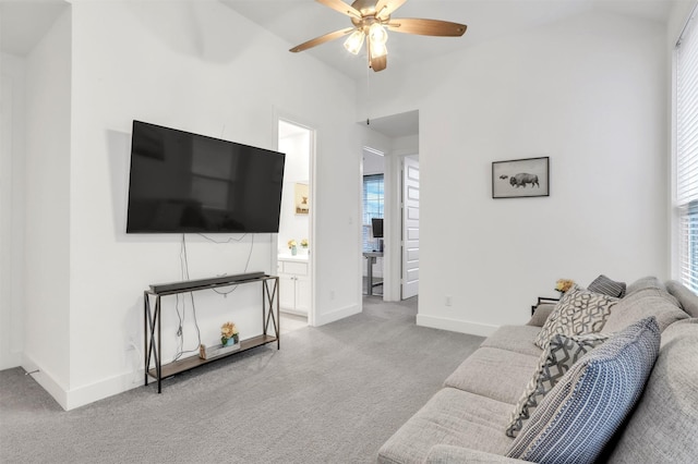 living room featuring carpet flooring and ceiling fan