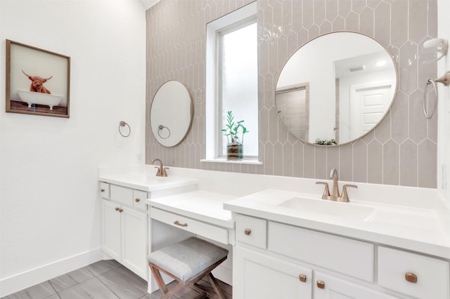 bathroom featuring a wealth of natural light and vanity