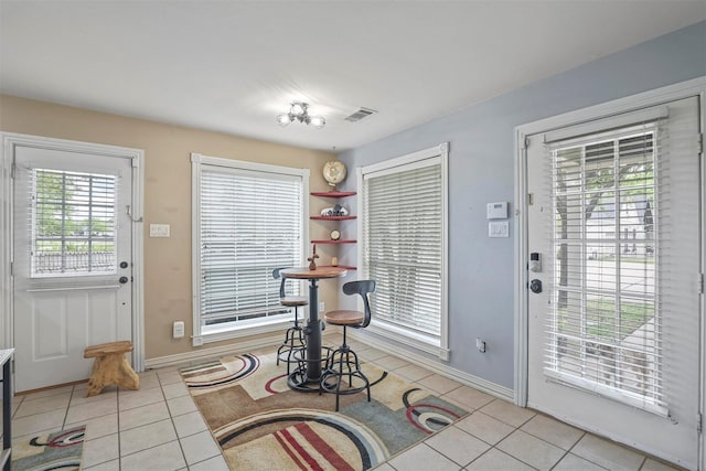 entryway featuring light tile patterned floors