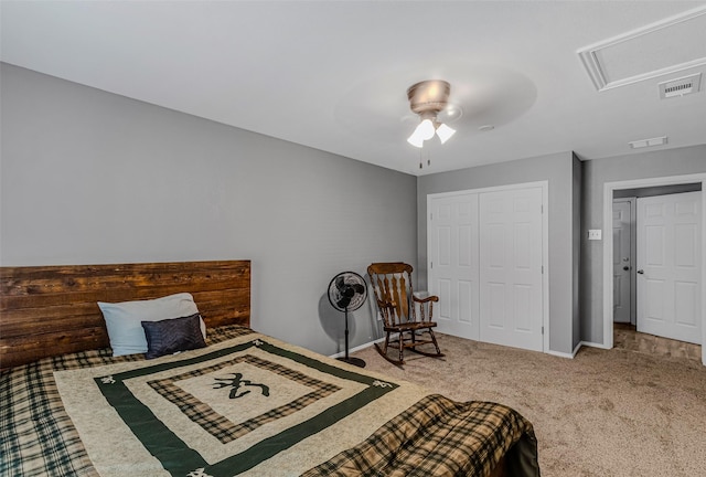 bedroom with ceiling fan, carpet floors, and a closet