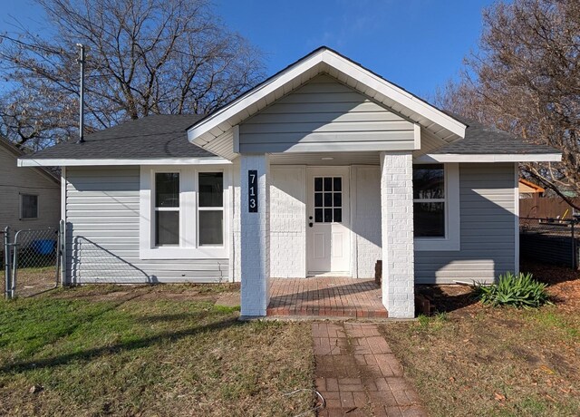 bungalow with a front lawn