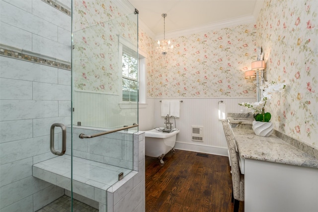 bathroom featuring heating unit, hardwood / wood-style floors, vanity, independent shower and bath, and ornamental molding