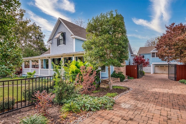 814 Barnes St, Mckinney, TX 75069 - view of front of house with a garage, a shingled roof, and decorative driveway