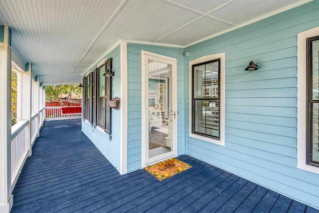 wooden deck featuring covered porch