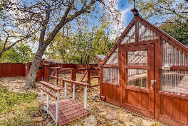 wooden deck with an outbuilding