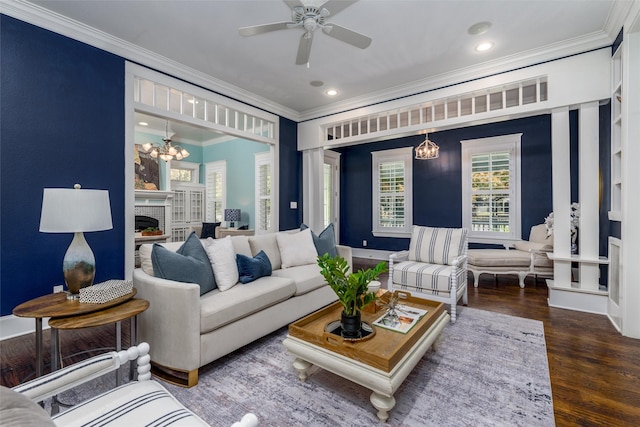 814 Barnes St, Mckinney, TX 75069 - living area with ornamental molding, ceiling fan, a chandelier, wood finished floors, and a fireplace