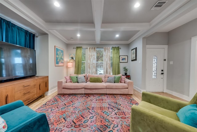 living room with light hardwood / wood-style flooring, beamed ceiling, coffered ceiling, and ornamental molding