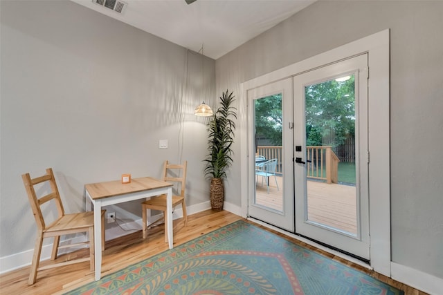 entryway featuring french doors and hardwood / wood-style floors